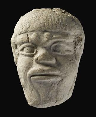 Mask of the demon Humbaba, whose "mouth is fire and breath death." Images of this figure were used as lucky charms.